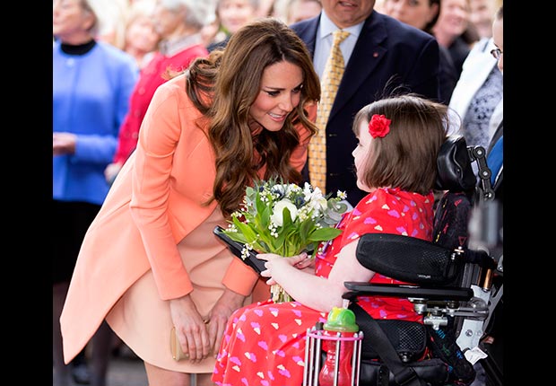 Catherine, Duchess of Cambridge is presented with flowers during a visit to Naomi House Children's Hospice. (Max Mumby/Indigo/Getty Images)