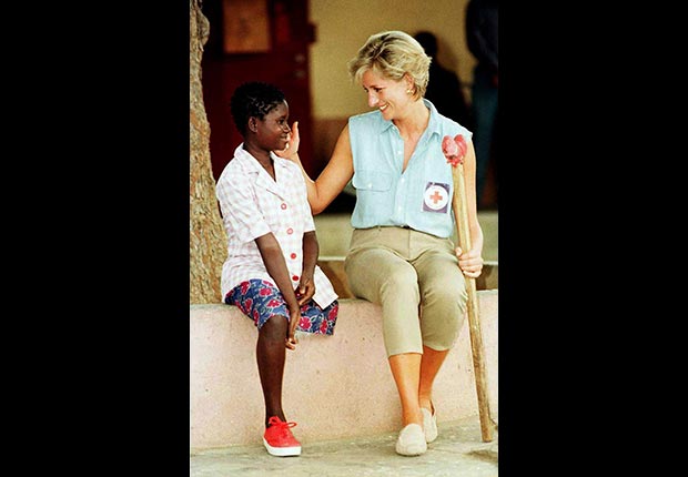 Princess Diana visits a young girl at an orthopedic workshop in Angola, January 1997. (Ian Jones/Zuma Press/Newscom)