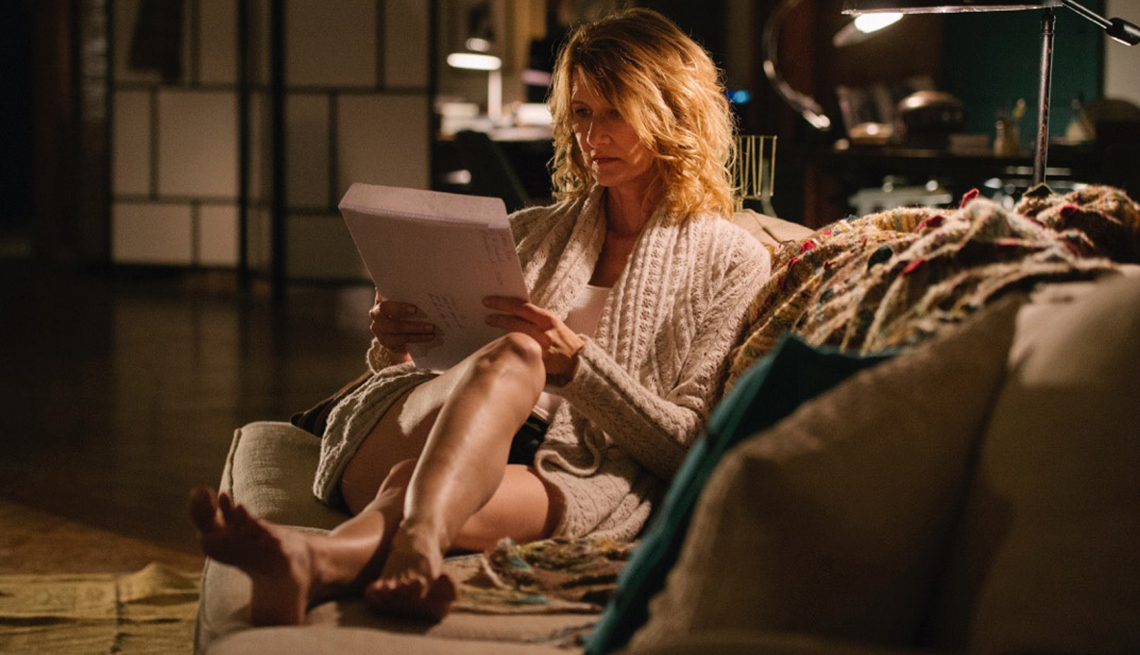 Laura Dern sitting on a couch in a scene from “The Tale”