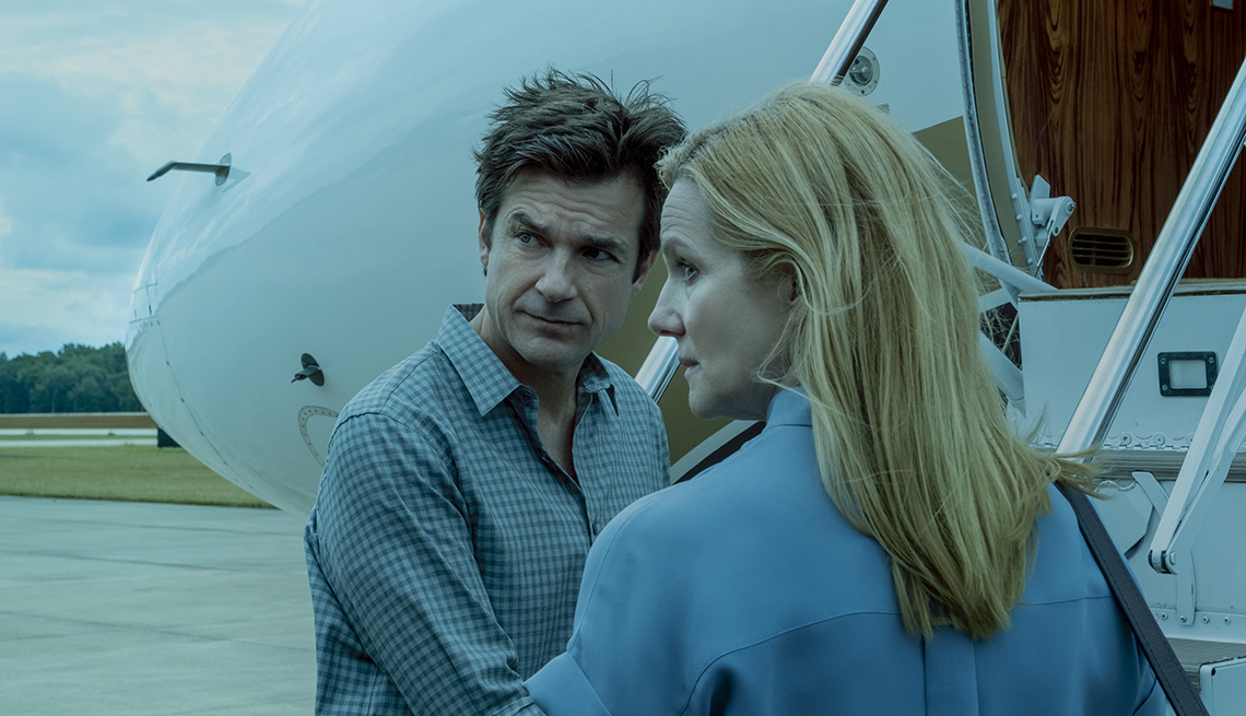 Jason Bateman and Laura Linney stand outside of a plane in Ozark
