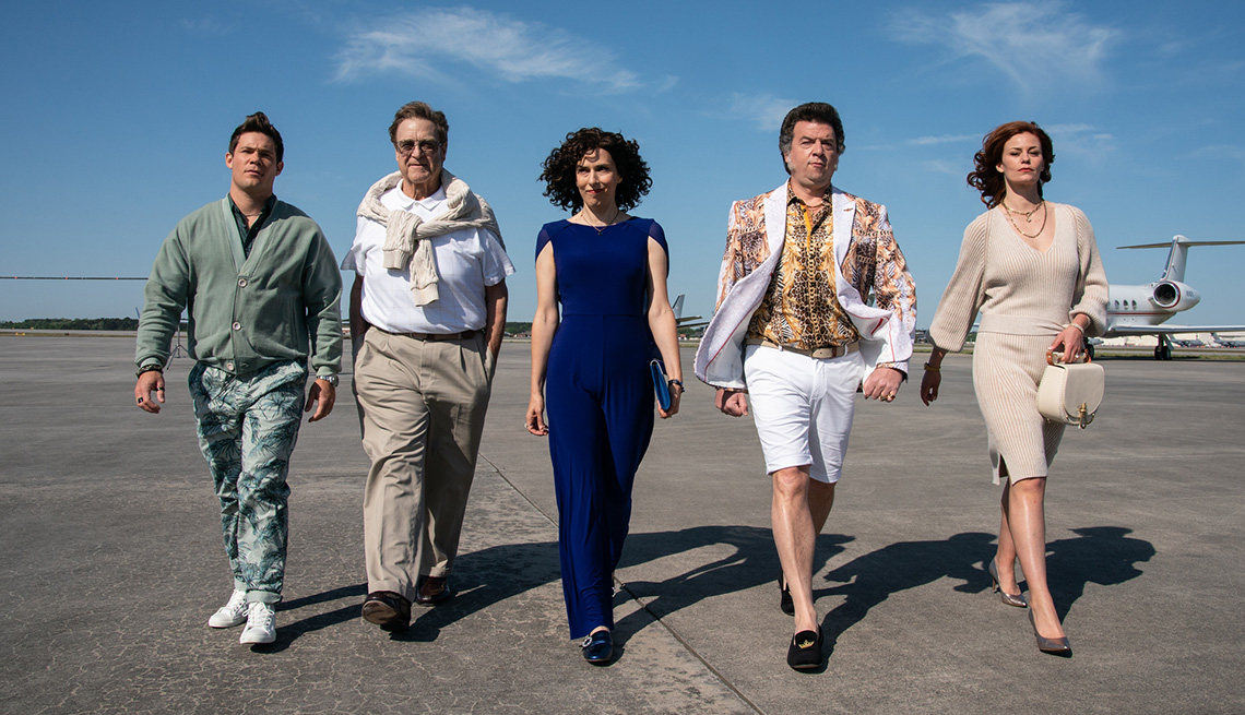 Adam Devine, John Goodman, Edi Patterson, Danny McBride, Cassidy Freeman walking outside on an airport tarmac for the television show The Rightgeous Gemstones