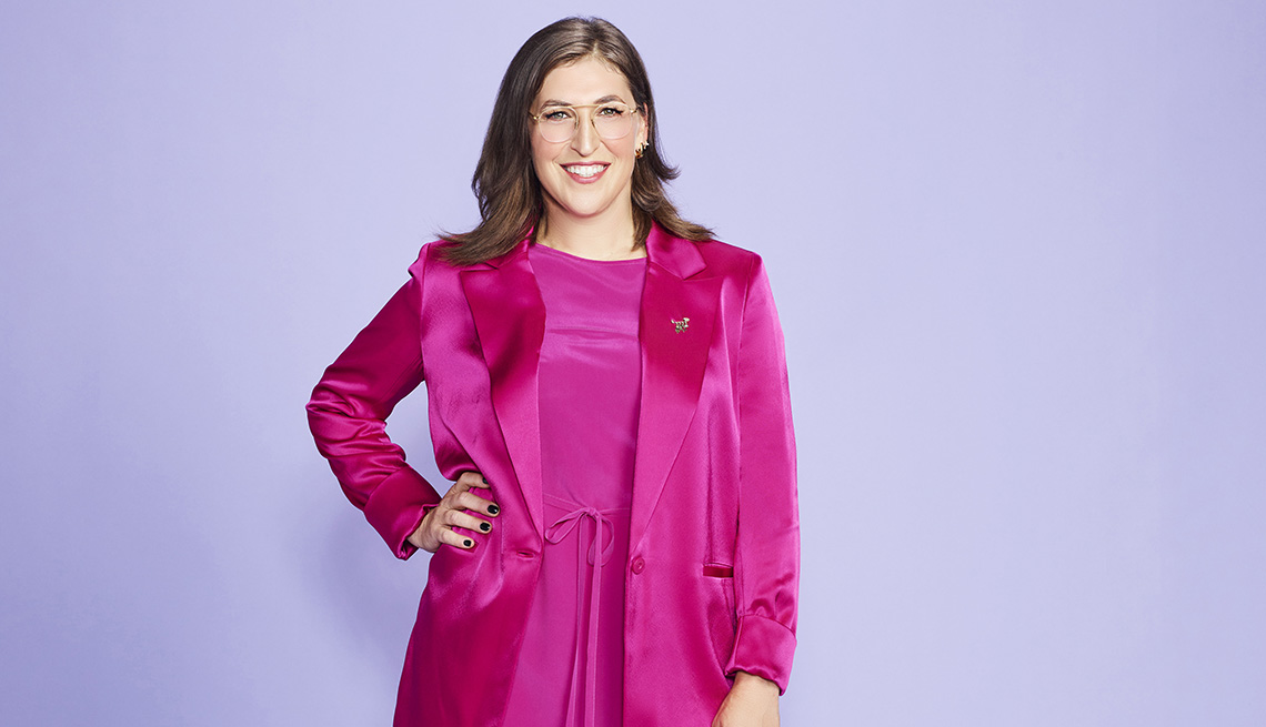 Celebrity Jeopardy host Mayim Bialik in a pink outfit