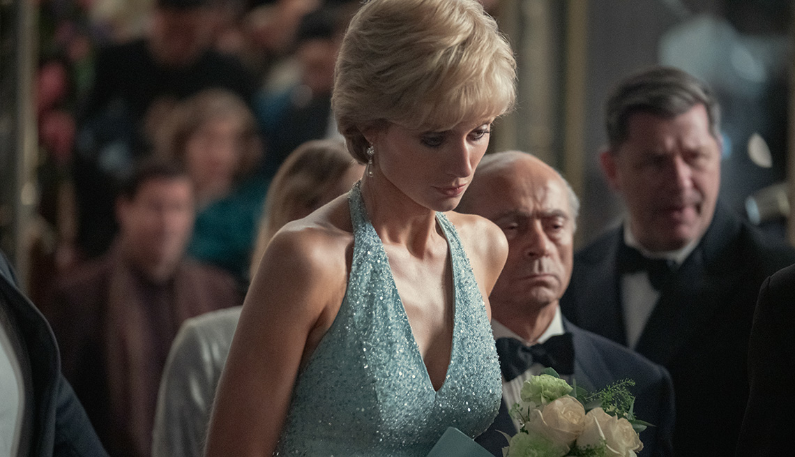 Elizabeth Debicki wearing a blue dress as she stars as Princess Diana in The Crown