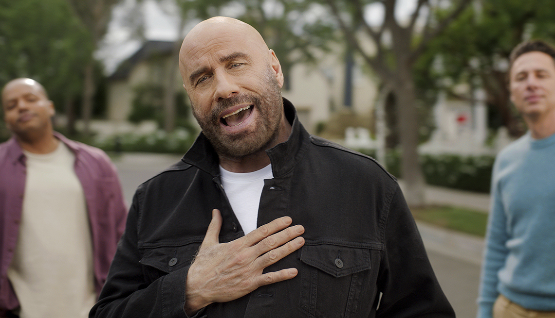 john travolta performs in a commercial during the super bowl