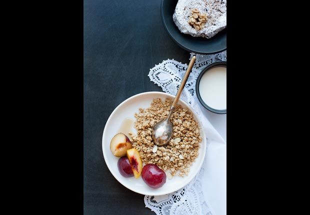 Plate of granola with fruit and cream, calorie dense foods