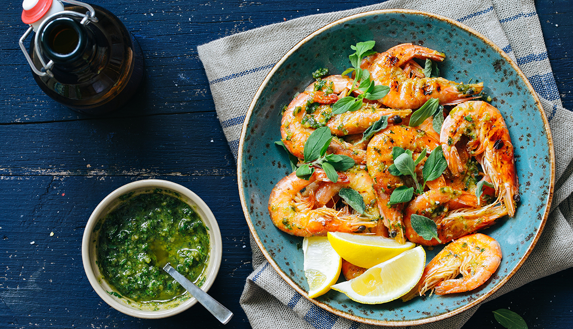 Shrimp in Shells in Bowl with Lemon and Herbs, Pot of Herbs in Olive Oil, 8 Healthy and Easy Super Bowl Snacks