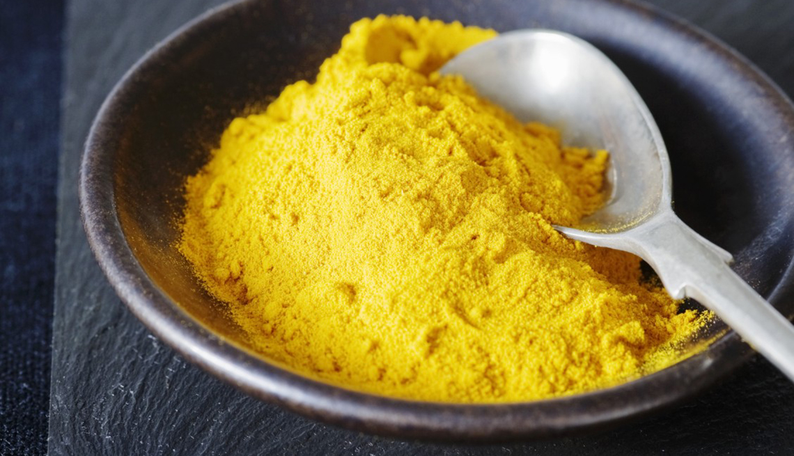 Turmeric Spice In Bowl With Spoon, Foods That Help Alleviate Pain