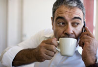Man sipping coffee may reduce risk of skin cancer