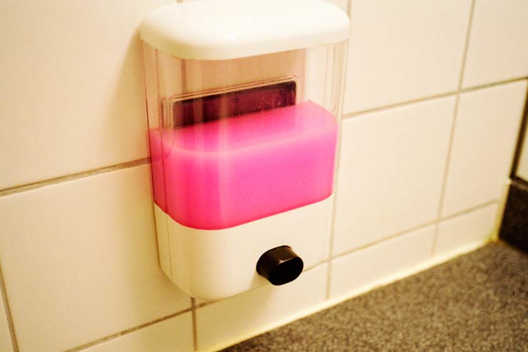Pink soap in a soap dispenser