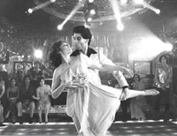 John Travolta dances in "Saturday Night Fever"