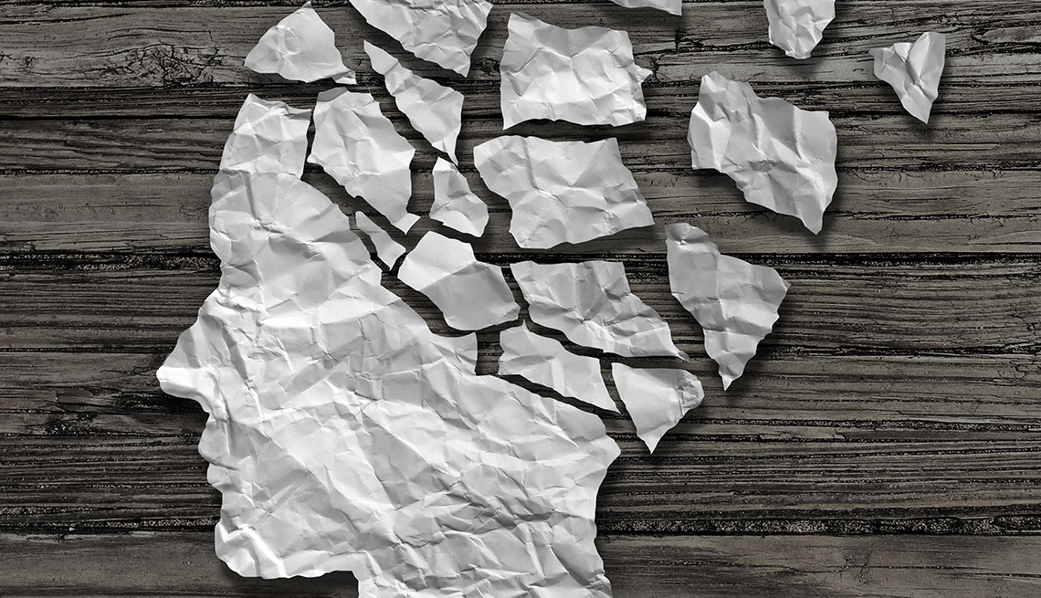 Silueta de una cabeza hecha de papel roto - Salud Cerebral