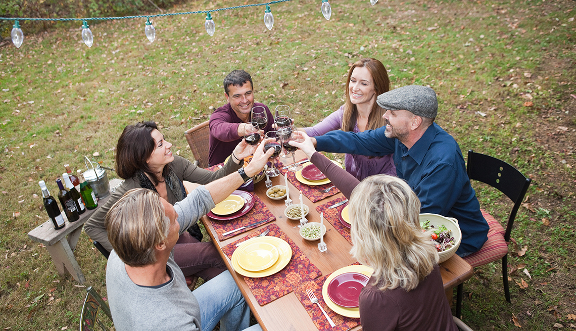 Friends toast outdoor dinner party, Diabetes prevention