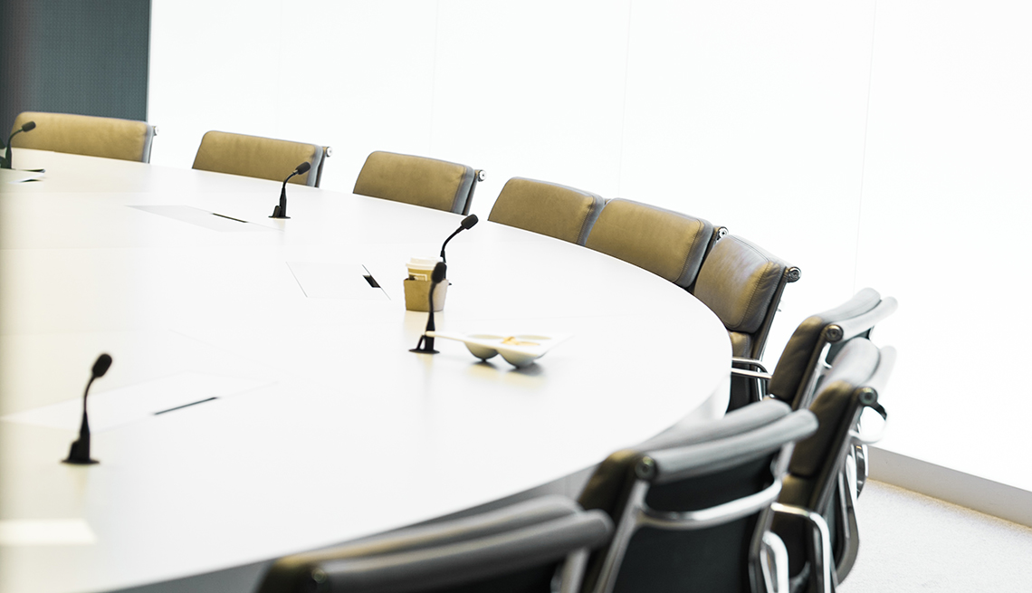 An office conference table, Workplace Hearing Loss coping strategies