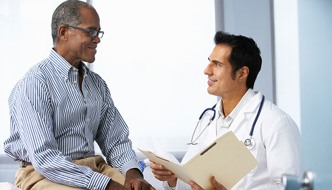 a doctor speaking with a patient at his office