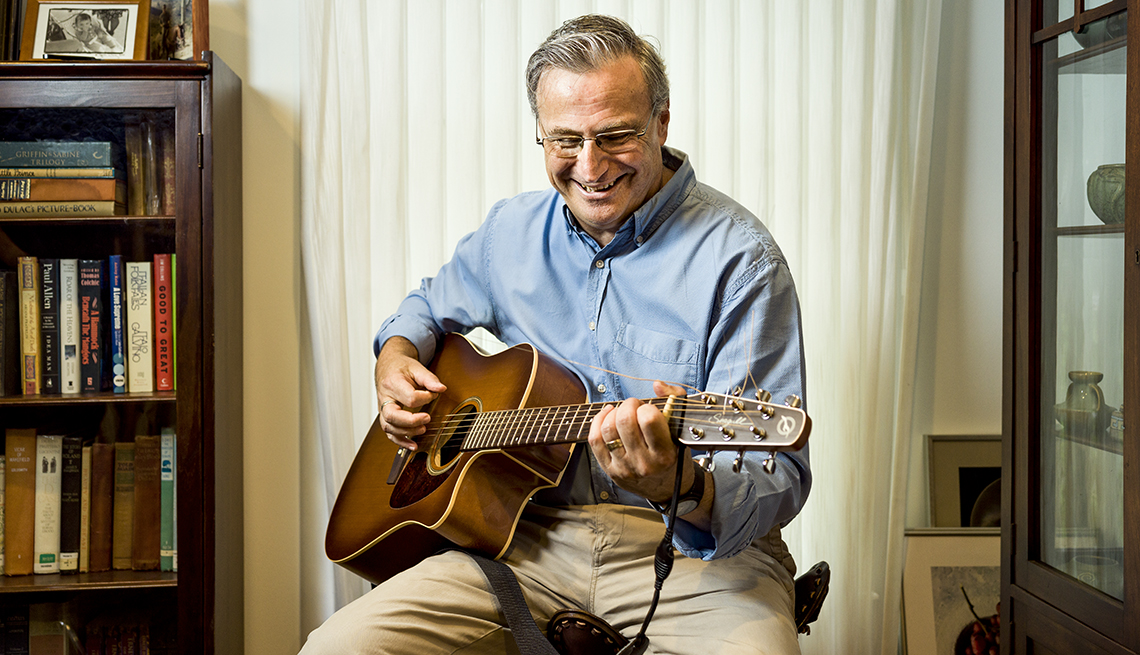 Neil Wertheimer playing a guitar