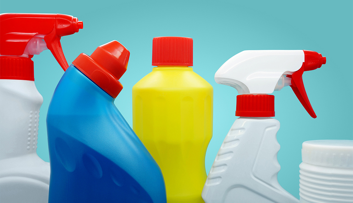 cleaning product bottles against a blue background