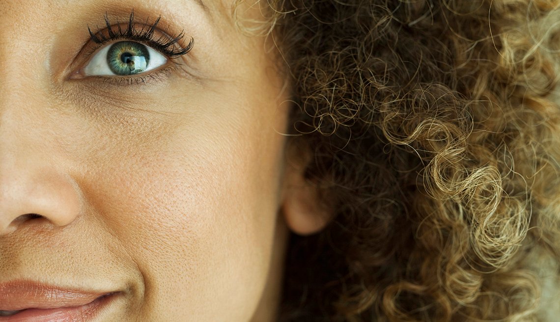 Close up of the side of a woman's face and her eye.