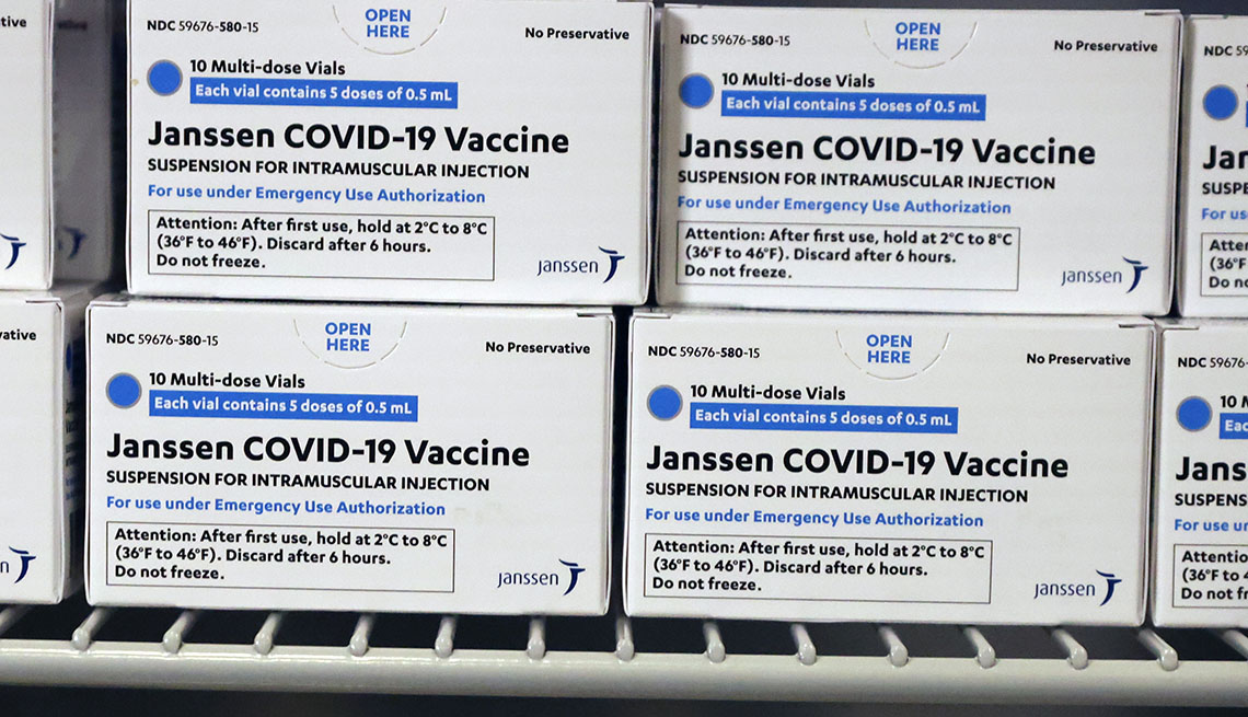 Boxes of Johnson & Johnson COVID-19 vaccine sits in a refrigerator
