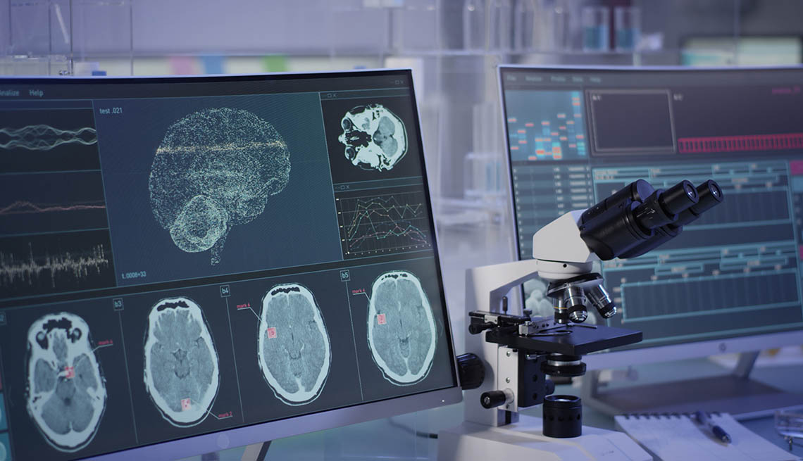 Research lab with brain scans and microscope