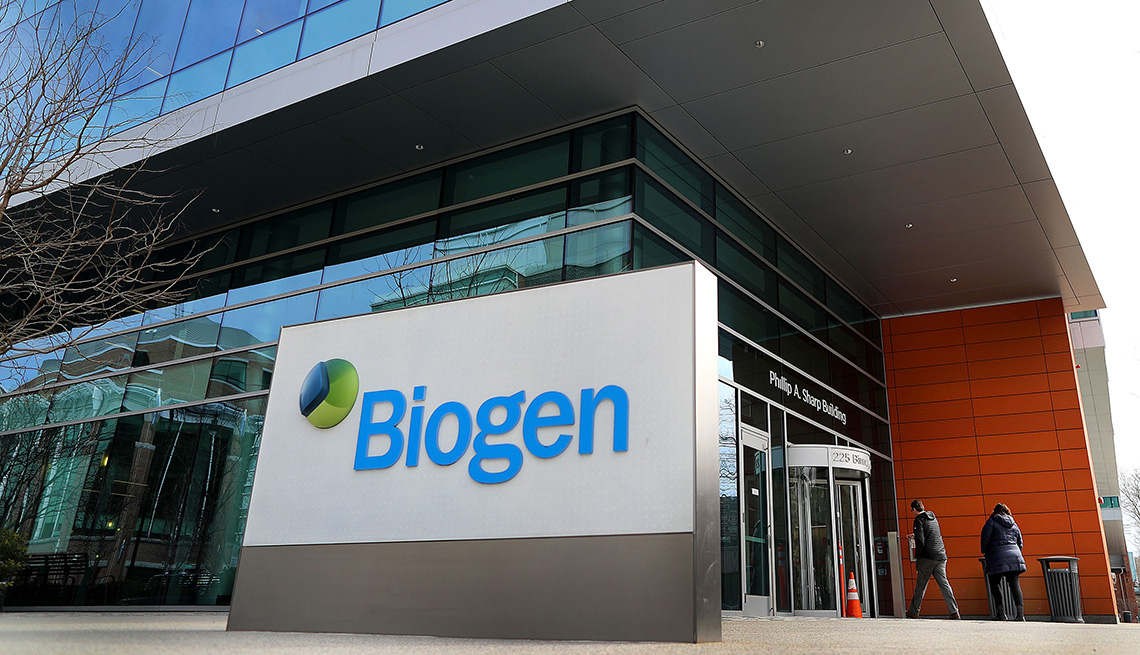 biotechnology company biogen sign in front of glass office building 