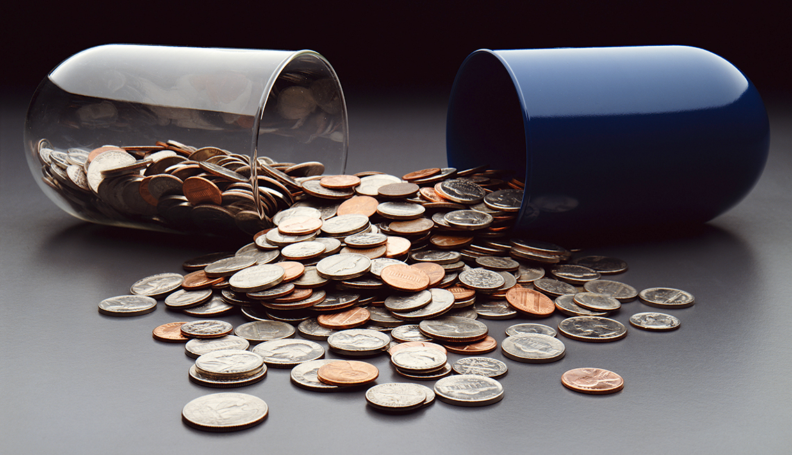 Capsule spilling coins, Cancer drug costs