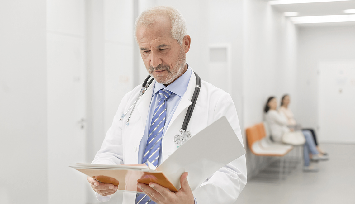Doctor reading a file or letter