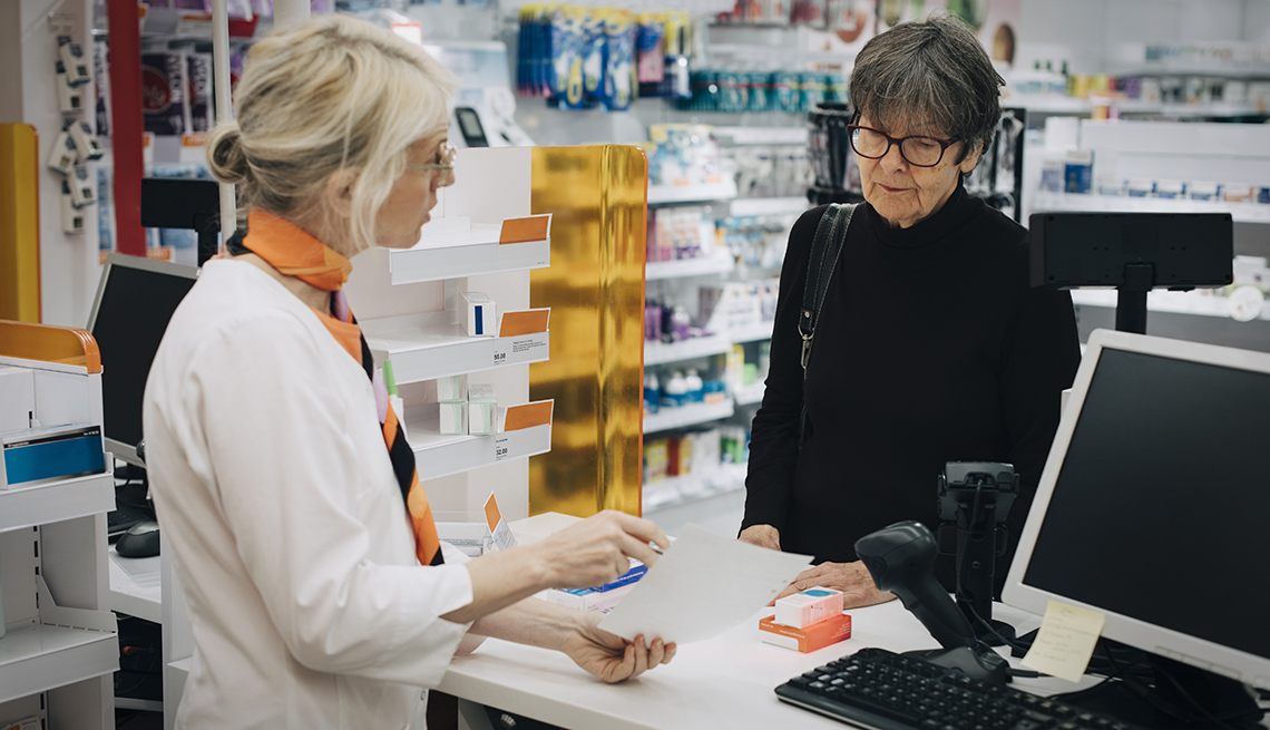 Pharmacist and woman at pharmacy