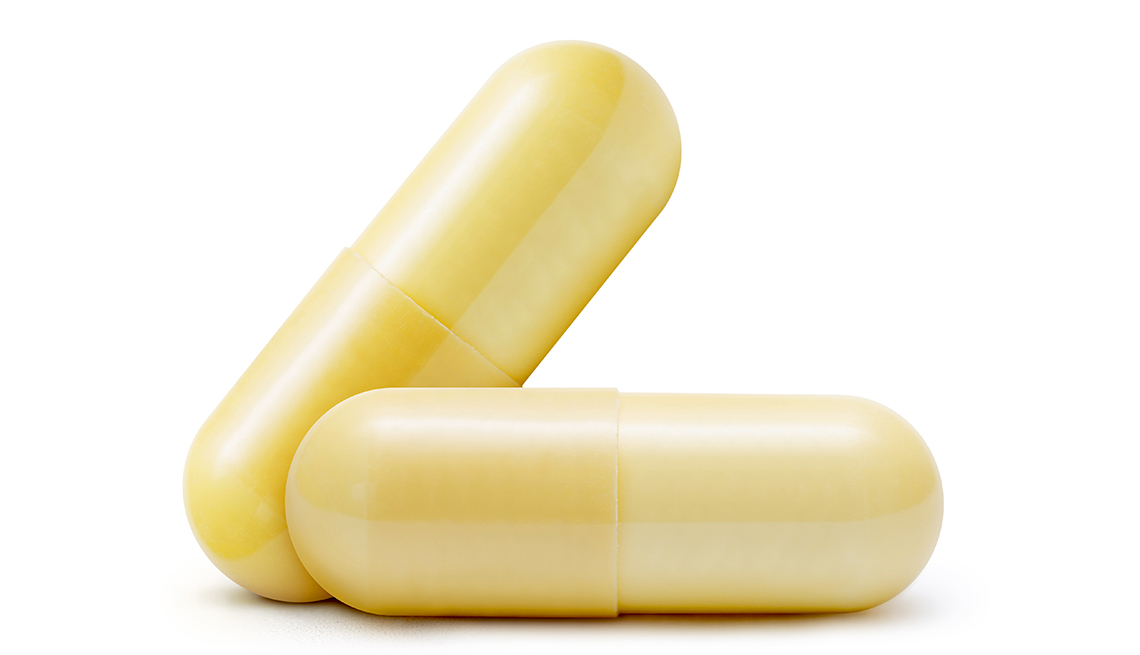 item 3 of Gallery image - two yellow capsule pills of gabapentrin are shown