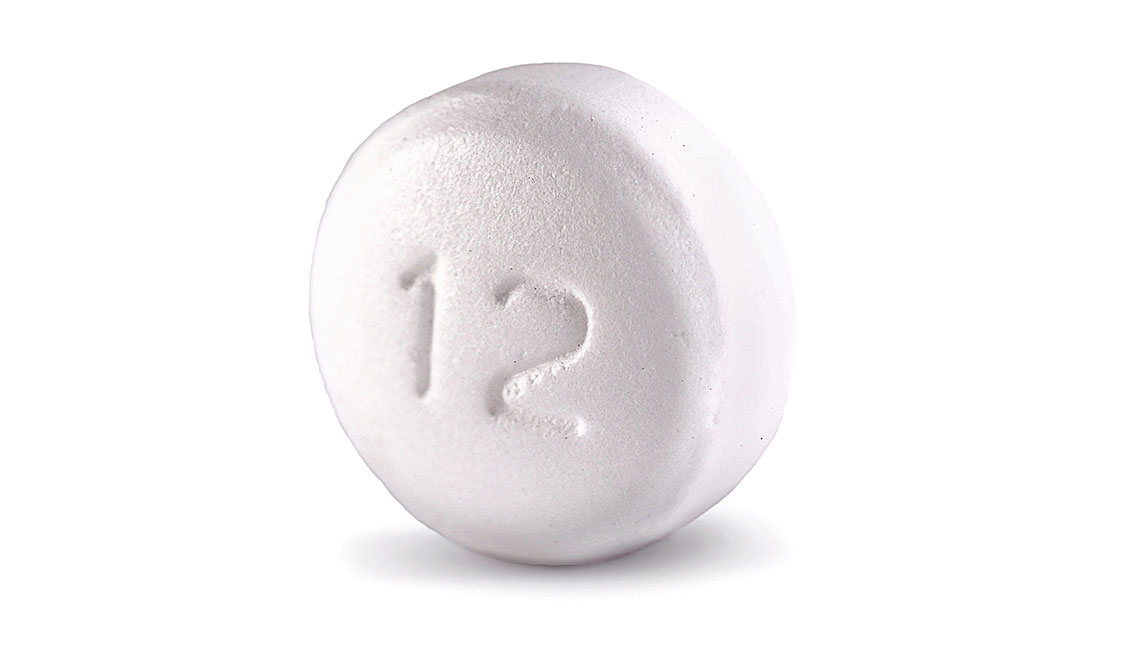 item 1 of Gallery image - a flat round white metroformin pill bearing the inscription of the number 12