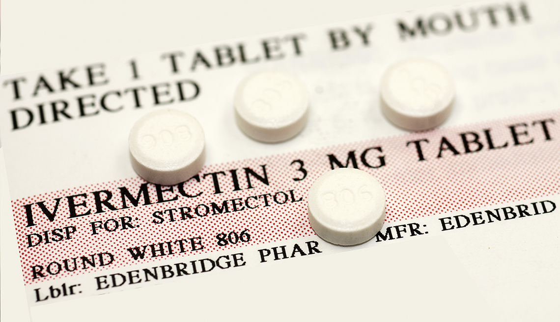 Ivermectin, 3 mg tablet, sitting on a prescription label.