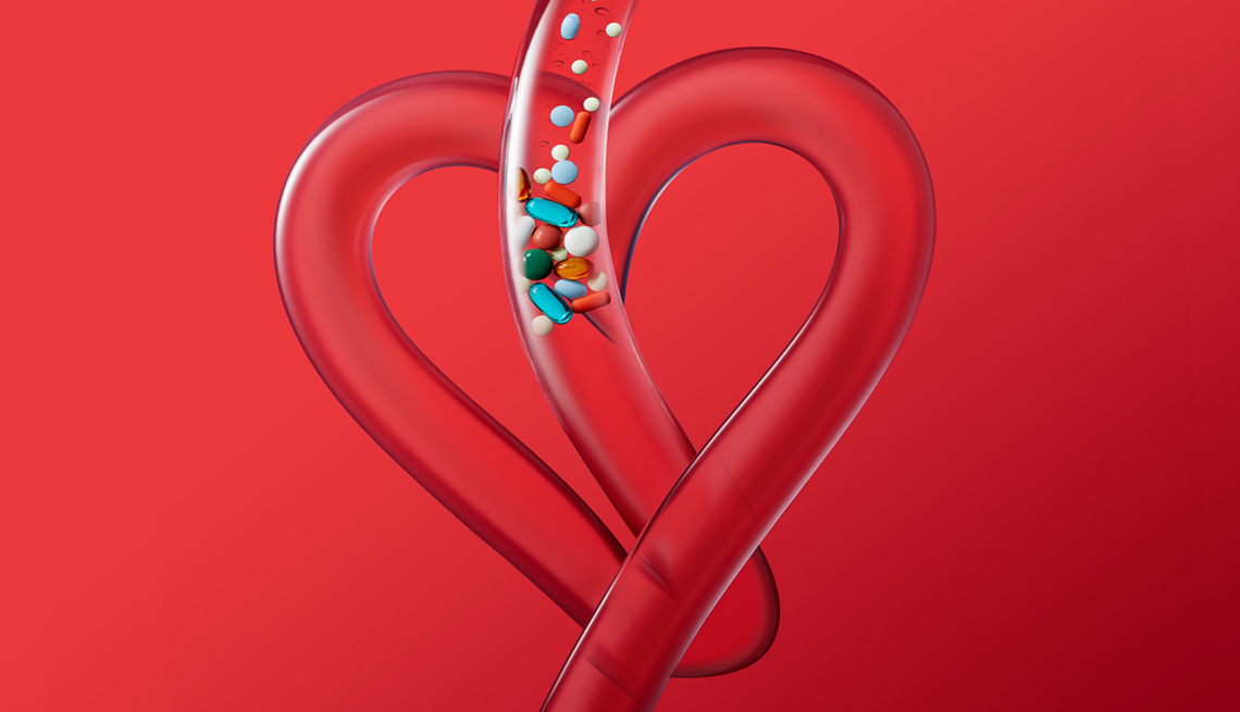 illustration of a clear tube bent into the shape of a heart showing medicine pills falling down into it