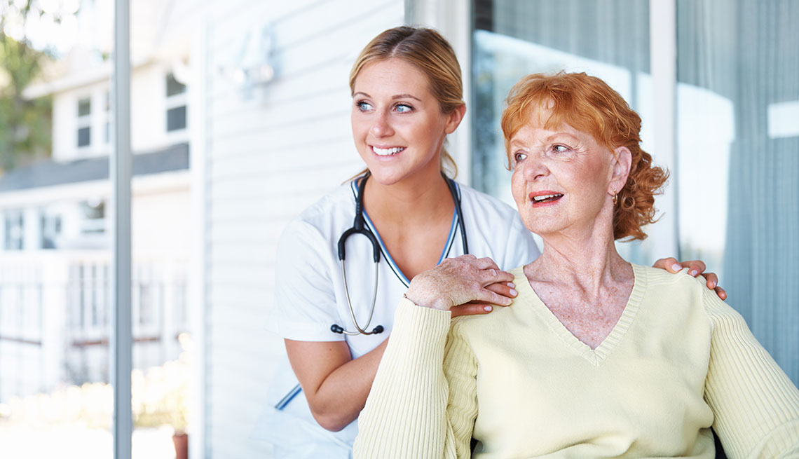 a mature woman reciving care at home by a nurse 
