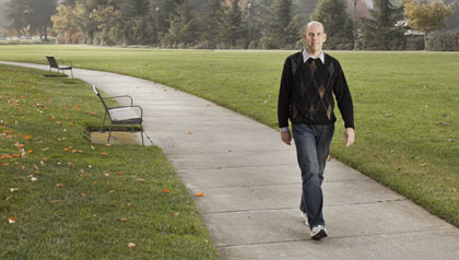 Rick Genter after his 200 pound weight loss, walking in a park. 