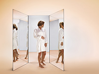 woman; mirror; flaws; health; 60s; wrinkles; age spots