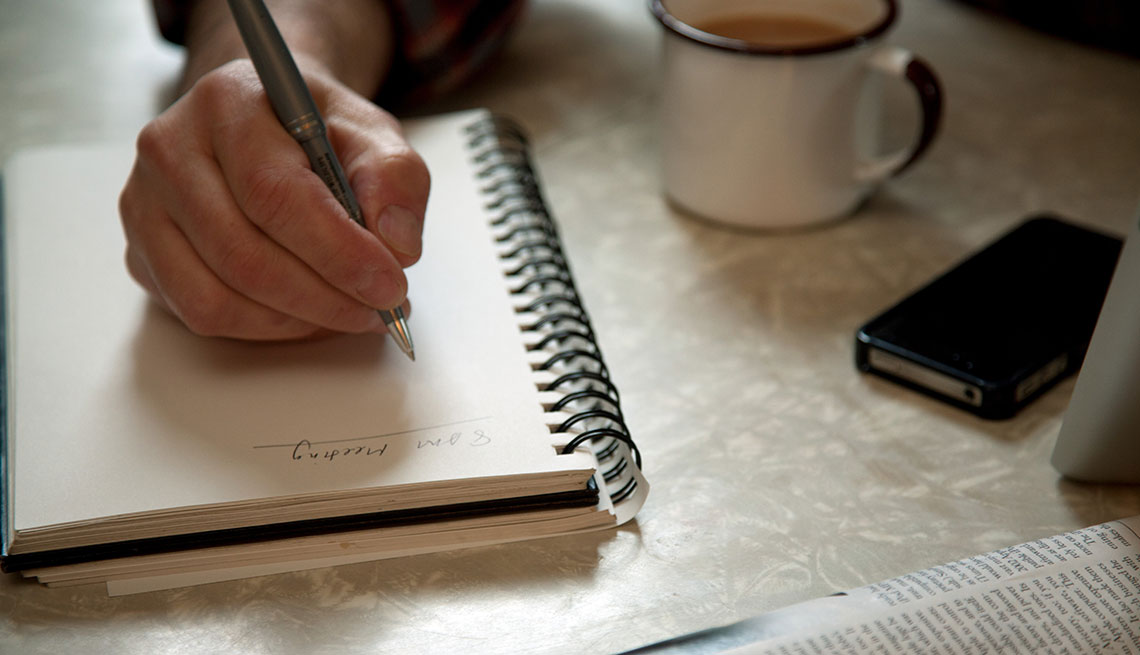 Man writes in notebook, Fall Back in Love