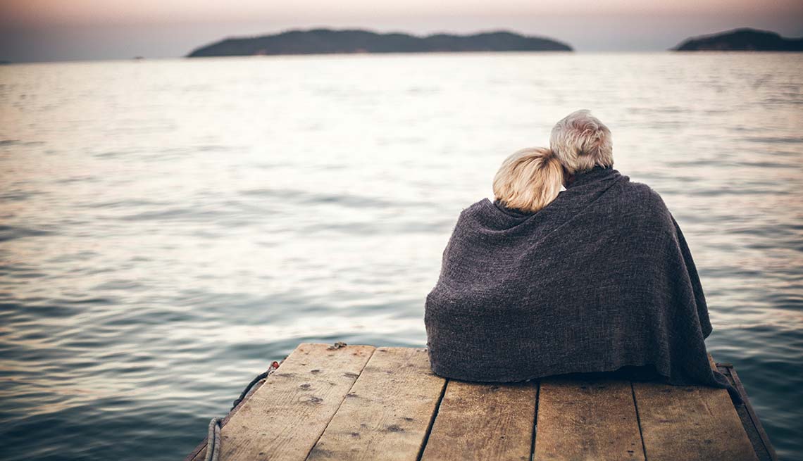 Couple in blanket on a dock, Intimacy Reduces Stress 
