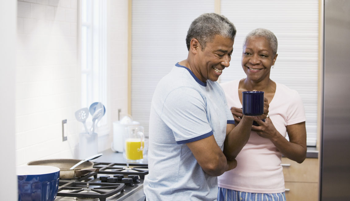 Couple laugh with kitchen coffee, 7 Ways to Make Your Morning Healthier 