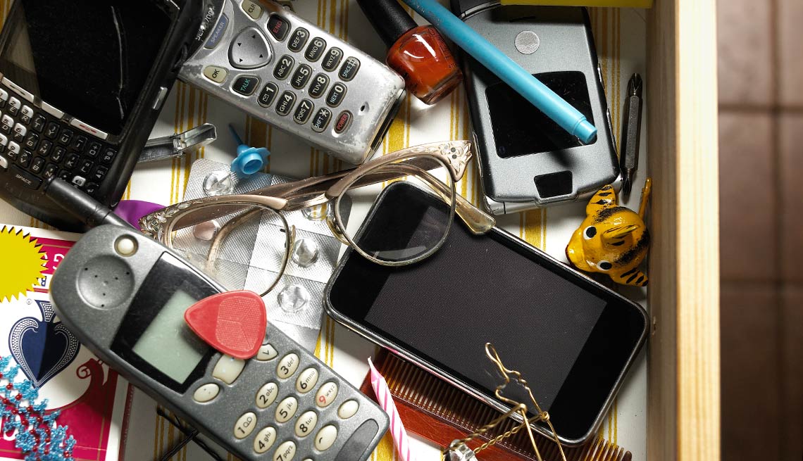 Old cellphones, remotes and things in a junk drawer, Things to Throw Out