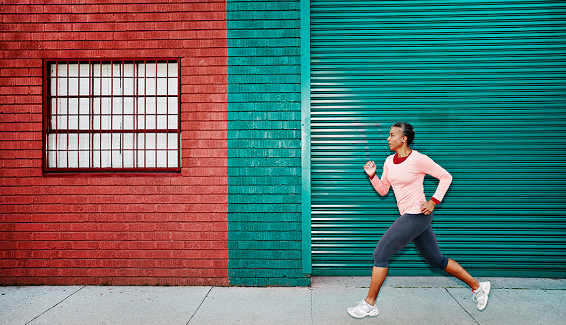 Woman Running past Red and Green Building, Small Changes, Healthy Living