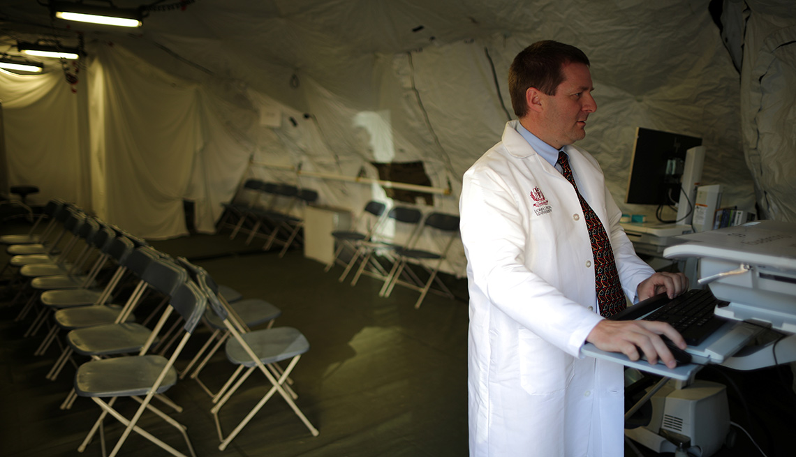 doctor working inside a hospital tent