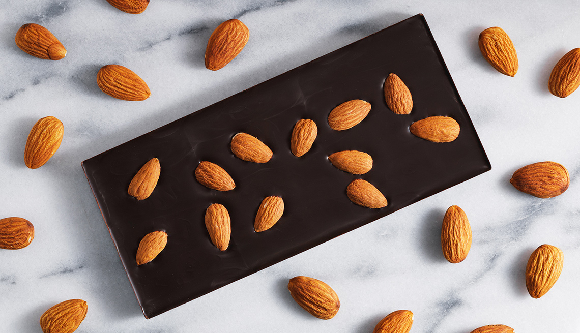 Almonds and dark chocolate on marble