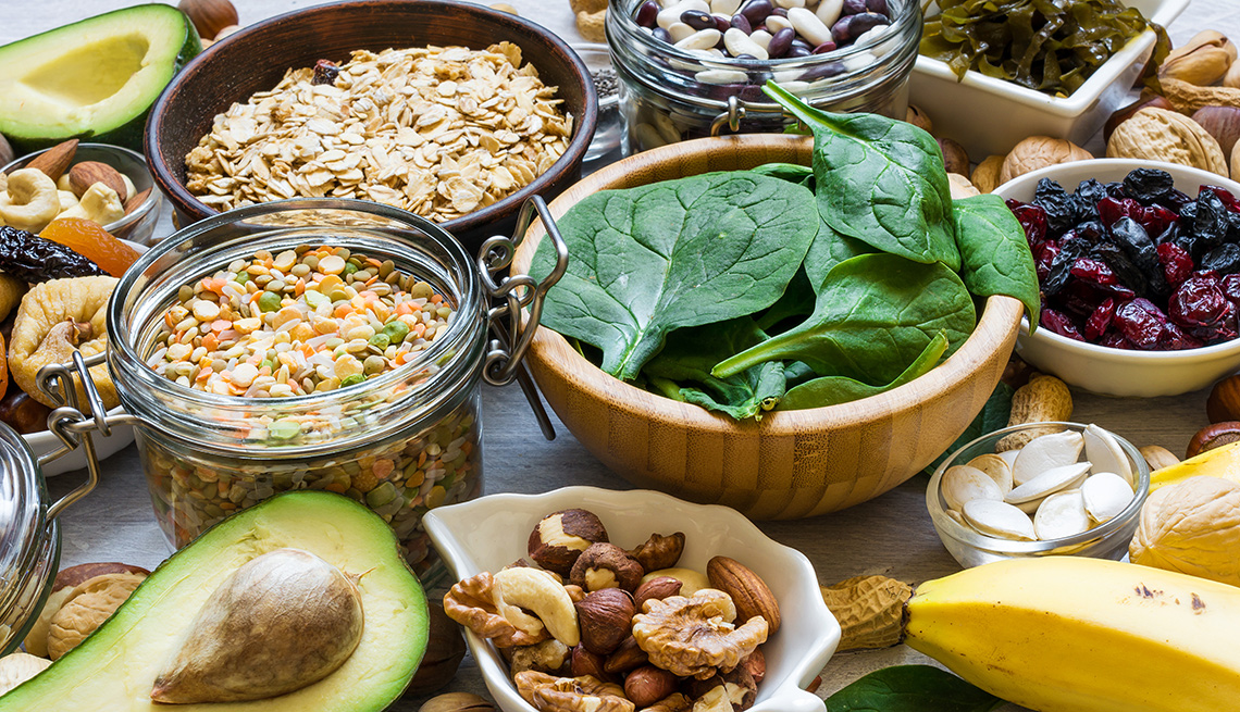 Magnesium rich foods including leafy greens, beans, nuts, and avocado