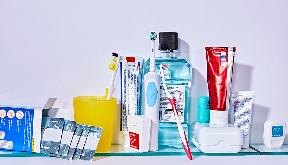 Assorted dental products including whitening strips, mouthwash, toothpaste, toothbrushes and dental floss. 