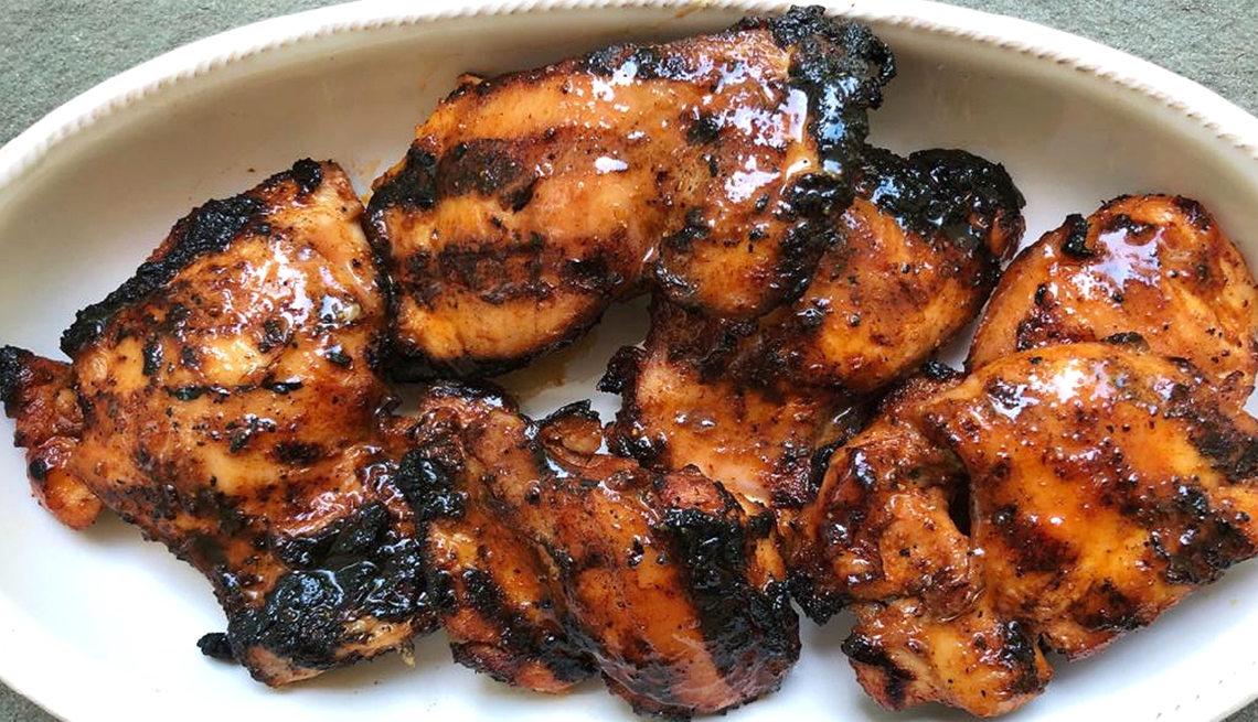 a plate of smoky barbeque chicken thighs