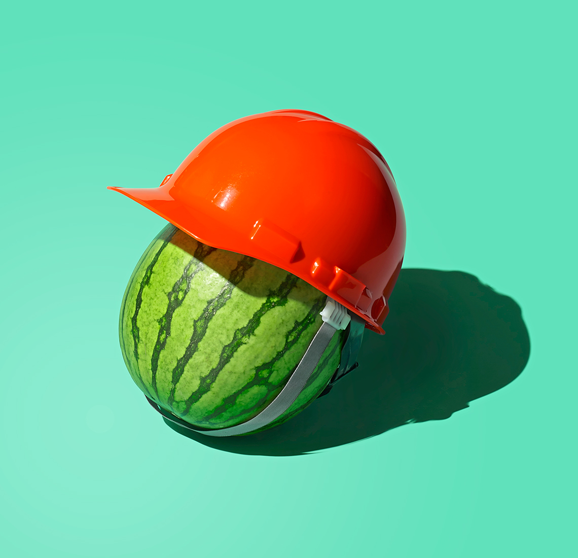 a watermelon wearing a hard hat