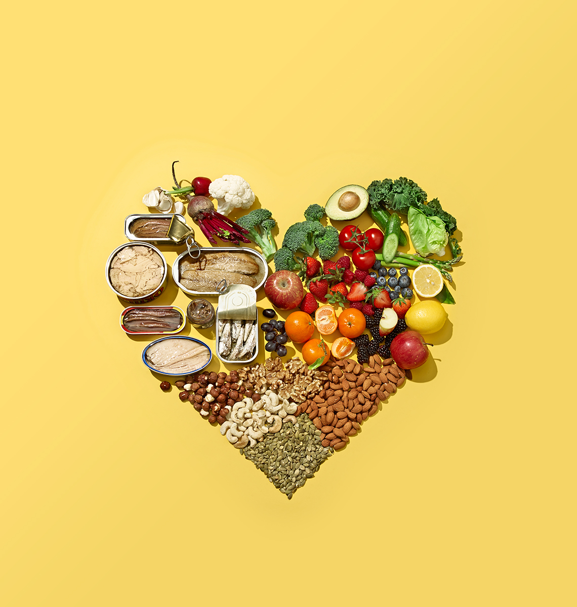 a heart made of various foods such as fish beans and vegetables