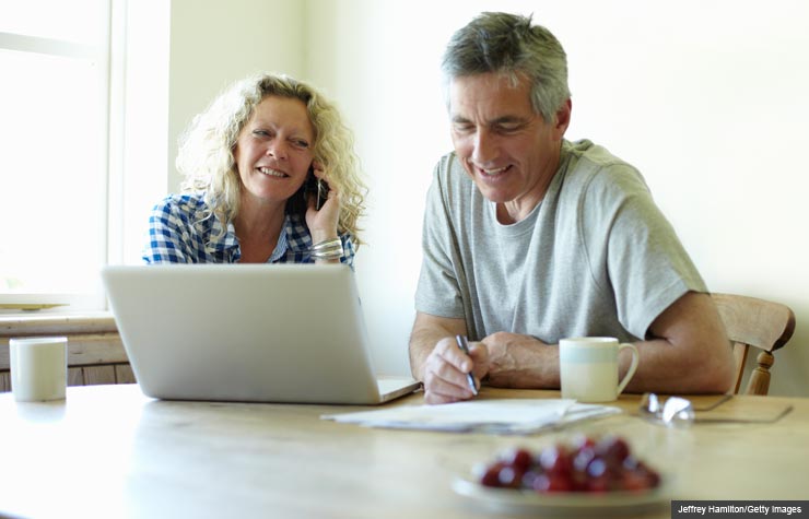Research different options and costs for Medicare open enrollment. (Richard Drury/Getty Images)