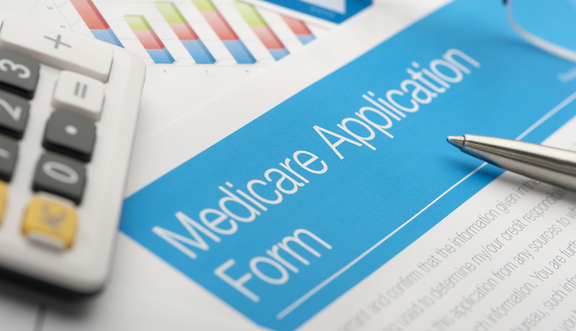 Medicare application form with paperwork