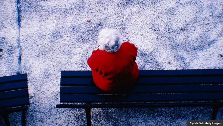 older woman alone on a park bench - what you need to know about long term care insurance
