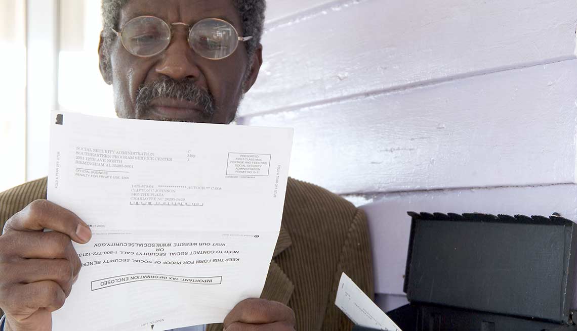 Man reads Social Security letter, Medicare changes AARP wants